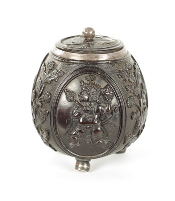 Lot 110 - AN 18TH CENTURY EASTERN SILVER METAL MOUNTED CARVED LIDDED COCONUT