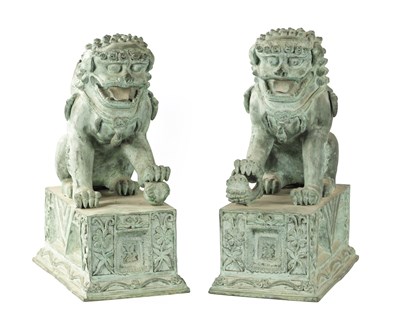 Lot 502 - A PAIR OF CHINESE GREEN PATINATED FOO DOGS