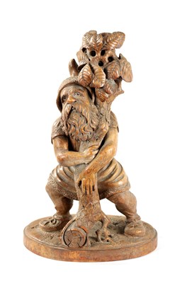 Lot 382 - A 19TH CENTURY BLACK FOREST CARVED LINDEN WOOD FIGURE