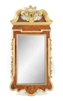 Lot 860 - A GEORGE II WALNUT AND PARCEL GILT HANGING MIRROR