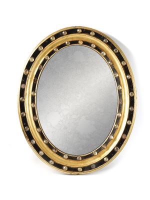 Lot 926 - A 19TH CENTURY IRISH GILT AND EBONISED MOULDED OVAL MIRROR