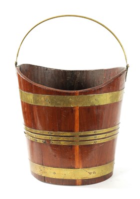 Lot 944 - A GEORGE III BRASS BOUND MAHOGANY OVAL PEAT BUCKET