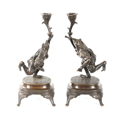 Lot 114 - A PAIR OF JAPANESE MEIJI PERIOD PATINATED BRONZE FIGURAL CANDLESTICKS