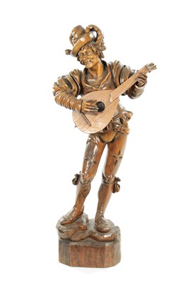 Lot 354 - A GOOD 19TH CENTURY BLACK FOREST CARVED LINDEN WOOD FIGURE OF A MUSICIAN