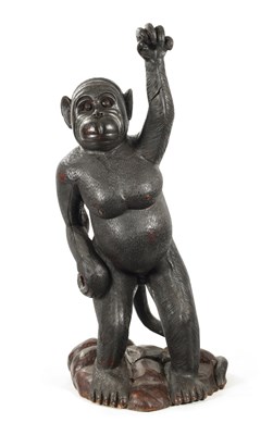 Lot 347 - A LIFE SIZE CARVED HARDWOOD SCULPTURE OF A STANDING MONKEY