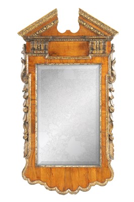 Lot 844 - A GEORGE II WALNUT AND PARCEL GILT ARCHITECTURAL HANGING MIRROR