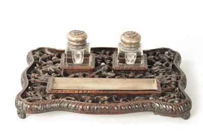 Lot 152 - A 19TH CENTURY CHINESE CARVED HARDWOOD AND SILVER MOUNTED DESK SET
