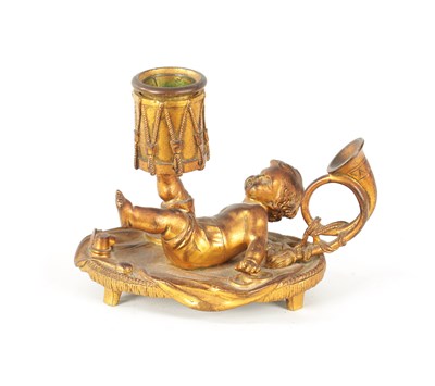 Lot 410 - A 19TH CENTURY FRENCH GILT BRONZE DRUMMER BOY CANDLE STICK