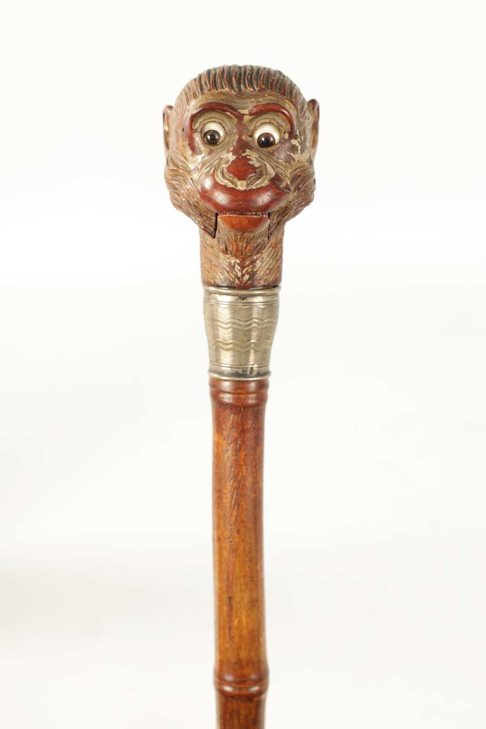 Lot 511 - A LATE 19TH CENTURY NOVELTY WALKING STICK FORMED AS A MONKEY HEAD WITH AUTOMATON EYES AND MOUTH