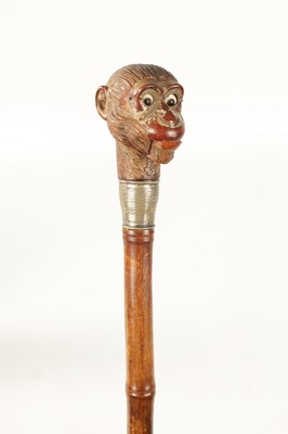 Lot 511 - A LATE 19TH CENTURY NOVELTY WALKING STICK FORMED AS A MONKEY HEAD WITH AUTOMATON EYES AND MOUTH