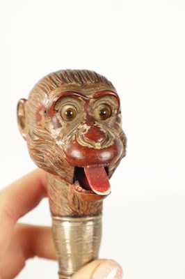 Lot 511 - A LATE 19TH CENTURY NOVELTY WALKING STICK FORMED AS A MONKEY HEAD WITH AUTOMATON EYES AND MOUTH