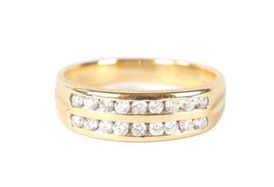 Lot 209 - AN 18CT GOLD AND DIAMOND DOUBLE BAND RING