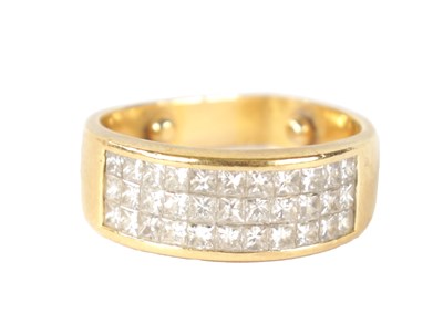 Lot 203 - AN 18CT GOLD AND DIAMOND TRIPLE BAND RING