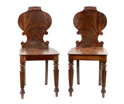 Lot 919 - A PAIR OF REGENCY FLAMED MAHOGANY HALL CHAIRS IN THE MANNER OF GILLOWS