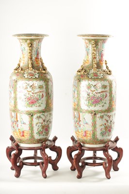 Lot 91 - A LARGE PAIR OF 19TH CENTURY CANTON FAMILLE ROSE VASES ON STANDS