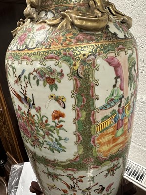 Lot 91 - A LARGE PAIR OF 19TH CENTURY CANTON FAMILLE ROSE VASES ON STANDS