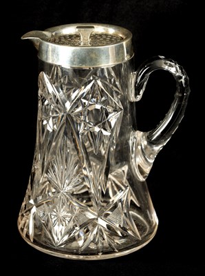 Lot 668 - AN EARLY 20TH CENTURY CUT GLASS AND SILVER MOUNTED LEMONADE  JUG