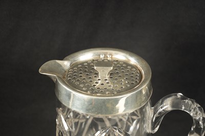 Lot 668 - AN EARLY 20TH CENTURY CUT GLASS AND SILVER MOUNTED LEMONADE  JUG