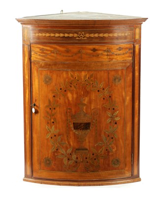 Lot 923 - A 19TH CENTURY MARQUETRY INLAID SATINWOOD ADAM STYLE BOW-FRONT CORNER CUPBOARD