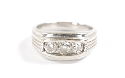 Lot 204 - A GENTLEMAN’S 18CT WHITE GOLD THREE STONE DIAMOND RING