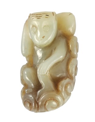 Lot 133 - A CHINESE CARVED RUSETT JADE MONKEY