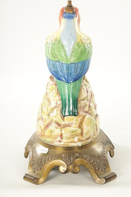 Lot 43 - AN EARLY 20TH CENTURY DOULTON PORCELAIN AND CAST BRASS TABLE LAMP FORMED AS A PARROT
