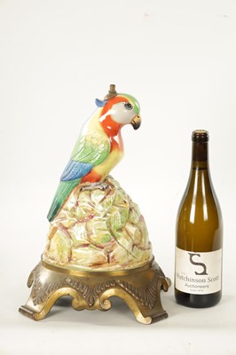 Lot 43 - AN EARLY 20TH CENTURY DOULTON PORCELAIN AND CAST BRASS TABLE LAMP FORMED AS A PARROT