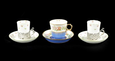 Lot 511 - A PAIR OF 19TH CENTURY SILVER MOUNTED COFFEE CANS AND SAUCERS TOGETHER WITH A SINGLE CUP AND SAUCER