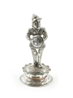 Lot 435 - A MINIATURE SILVER FIGURE OF A MUSICIAN