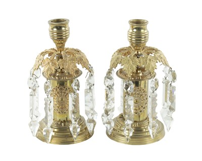 Lot 376 - A PAIR OF MID 20TH CENTURY BRASS LUSTRE CANDLESTICKS