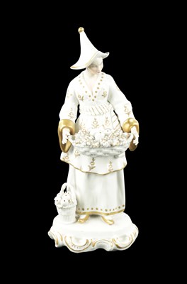 Lot 239 - A 19TH CENTURY SITZENDORF PORCELAIN FIGURE OF AN ORIENTAL FRUIT SELLER