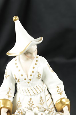 Lot 239 - A 19TH CENTURY SITZENDORF PORCELAIN FIGURE OF AN ORIENTAL FRUIT SELLER