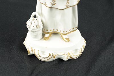 Lot 239 - A 19TH CENTURY SITZENDORF PORCELAIN FIGURE OF AN ORIENTAL FRUIT SELLER