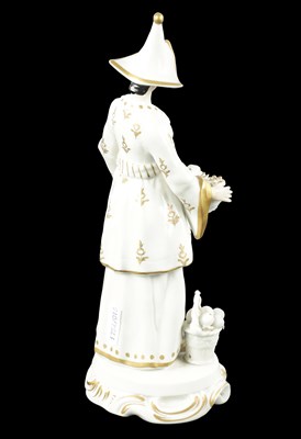 Lot 239 - A 19TH CENTURY SITZENDORF PORCELAIN FIGURE OF AN ORIENTAL FRUIT SELLER