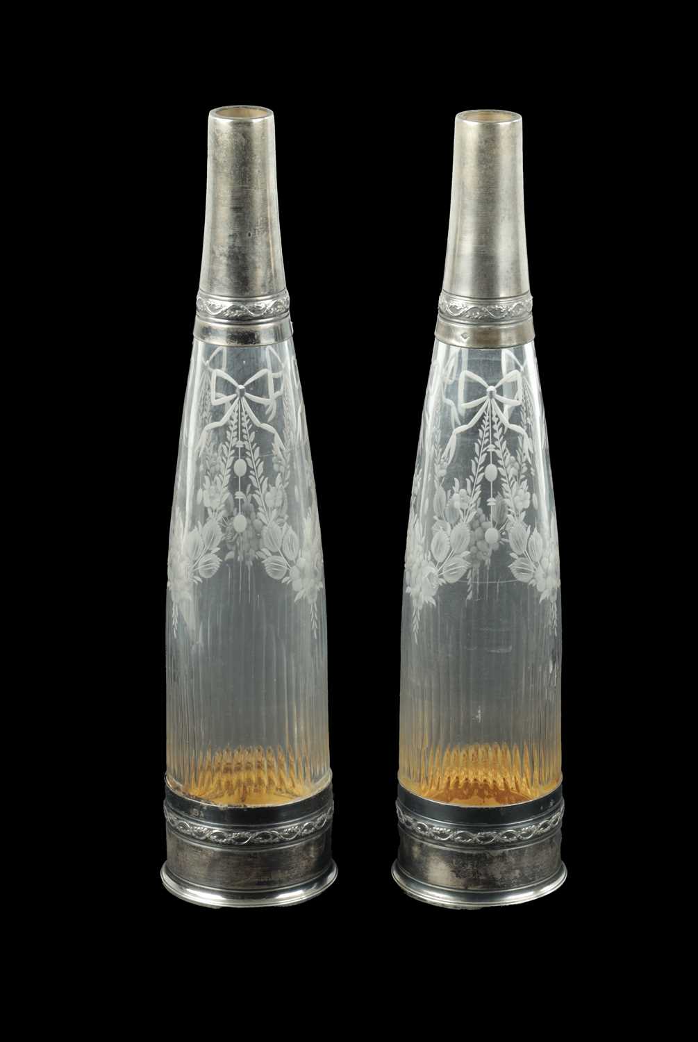 Lot 724 - A PAIR OF FRENCH SILVER TOPPED AND CUT GLASS DECANTER BOTTLES