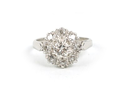 Lot 106 - AN 18CT WHITE GOLD DIAMOND CLUSTER RING