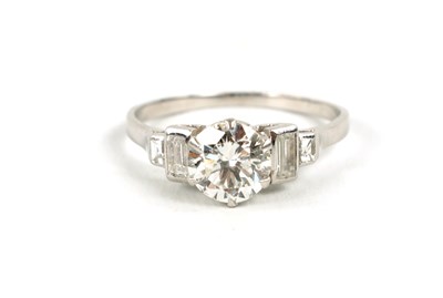 Lot 433 - AN ART DECO STYLE PLATINUM DIAMOND FIVE-STONE RING