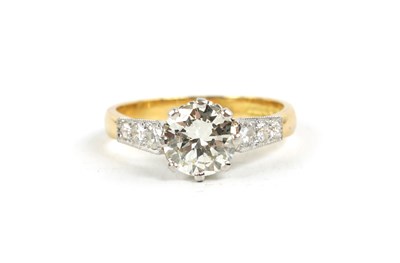 Lot 338 - A STYLISH 18CT GOLD SEVEN STONE DIAMOND RING