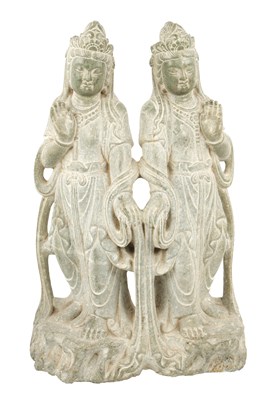 Lot 523 - AN ORIENTAL CARVED STONE SCULPTURE OF TWO ASIAN DEITIES