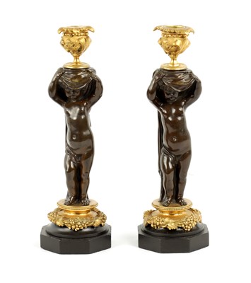 Lot 85 - A PAIR OF EARLY 19TH CENTURY BRONZE AND ORMOLU FIGURAL CANDLESTICKS