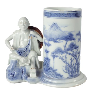 Lot 122 - A 19TH CENTURY JAPANESE PORCELAIN FIGURAL BRUSH POT