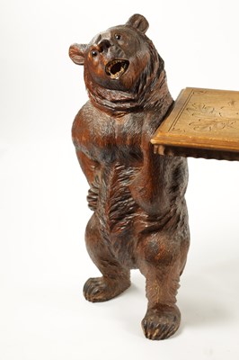 Lot 1068 - A GOOD 19TH CENTURY BLACK FOREST LINDEN WOOD CARVED BEAR HALL BENCH