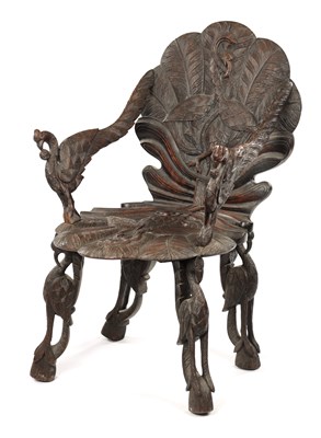 Lot 594 - A 19TH CENTURY ANGLO-INDIAN CARVED HARDWOOD ARMCHAIR
