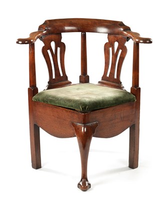 Lot 1407 - A MID 18TH CENTURY WALNUT CORNER COMMODE CHAIR OF FINE COLOUR AND PATINA