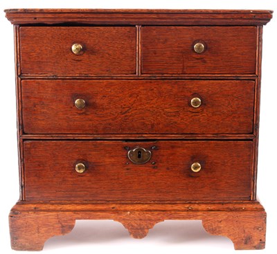 Lot 656 - An early 18th Century Oak Miniature CHEST OF...