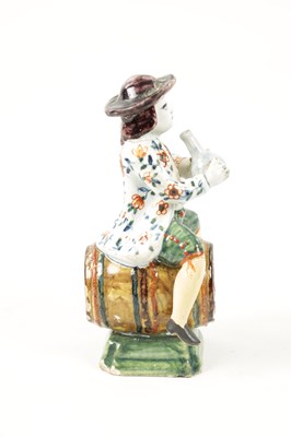 Lot 465 - AN 18TH / 19TH CENTURY DELFT POLYCHROME FIGURE