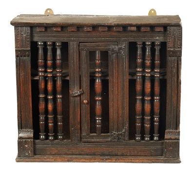 Lot 1469 - A MID 17TH CENTURY OAK LIVERY HANGING CUPBOARD