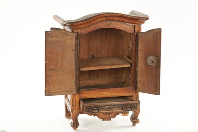 Lot 1061 - AN 18TH CENTURY FRUITWOOD MINIATURE ARMOIRE