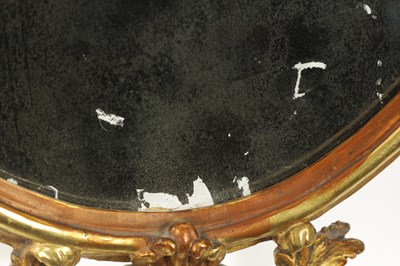 Lot 1457 - AN 18TH CENTURY CARVED GILTWOOD OVAL HANGING MIRROR