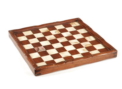 Lot 373 - A 19TH CENTURY CHINESE SIMULATED BAMBOO CARVED HARDWOOD AND MOTHER OF PEARL CHEQUERED GAMES BOARD